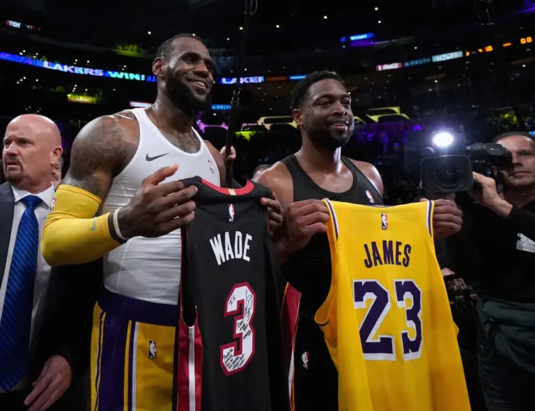 LeBron James #23 of the Los Angeles Lakers and Dwyane Wade #3 of the Miami Heat