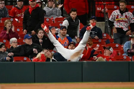 Nolan Arenados Insane Foul Ball Catch Sends Him Into Front Row Surprising Fans During Cardinals Mets Game