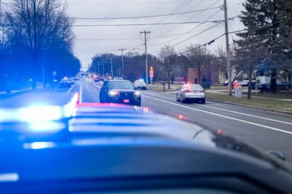 A large police presence lines the street in front of Abundant Life Christian School after a school shooting