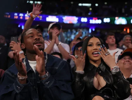 NFL Player Stefon Diggs (R) and rapper Cardi B (L)