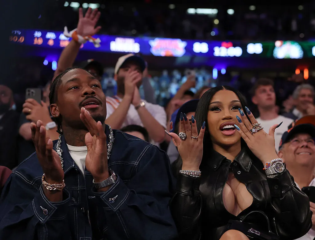 NFL Player Stefon Diggs (R) and rapper Cardi B (L)