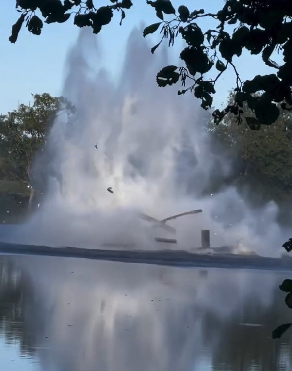 A huge splash occurred as the helicopter crashed into the water with debris flying