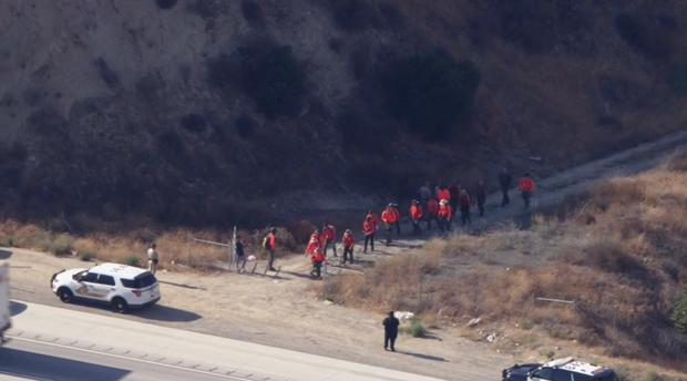A team of people searching for Emmanuel Haro