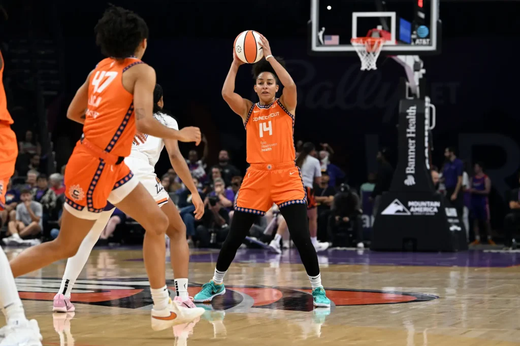 Bria Hartley of the Connecticut Sun looks to pass the ball against the Phoenix Mercury