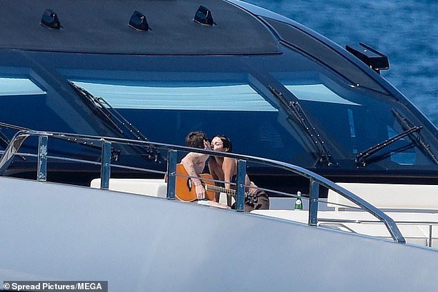 Cruz leaned in for a kiss with a smitten Jackie after serenading her in the sunshine