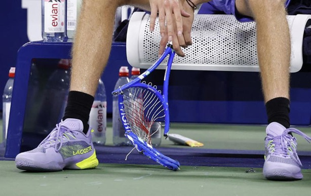 Daniil Medvedev breaks his racket after losing against Benjamin Bonzi