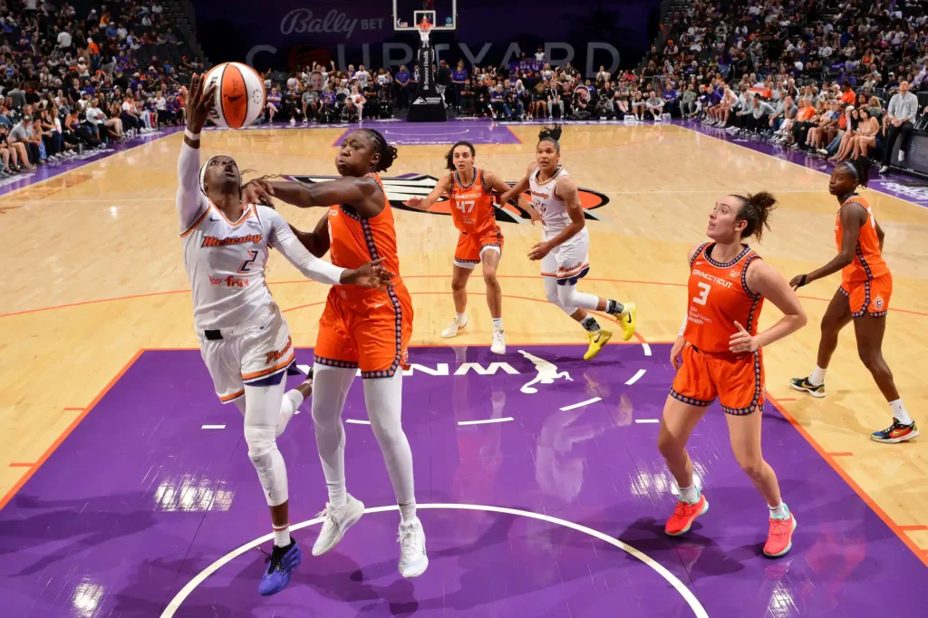 Kahleah Copper of the Phoenix Mercury drives to the basket during the game against the Connecticut Sun