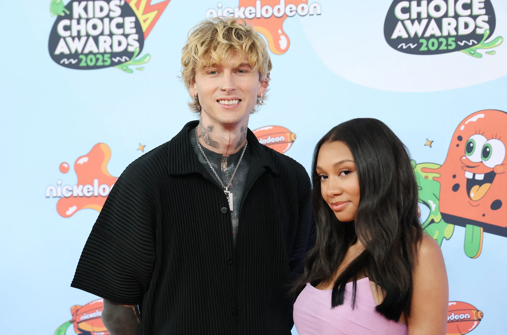 Machine Gun Kelly (L) and Casie Baker