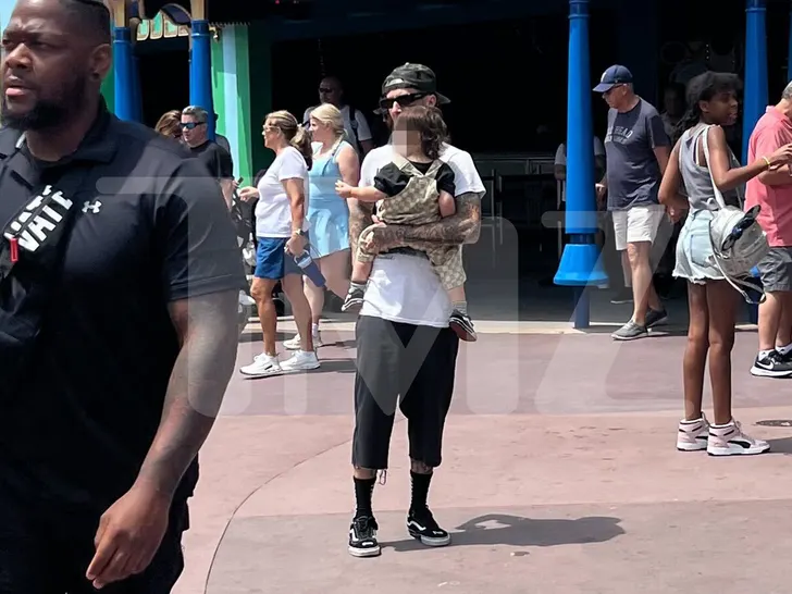 Travis Barker & Baby Rocky Melt Hearts at Disney’s Magic Kingdom 1 Travis Barker Takes Baby Rocky to Disney for a Magical Day