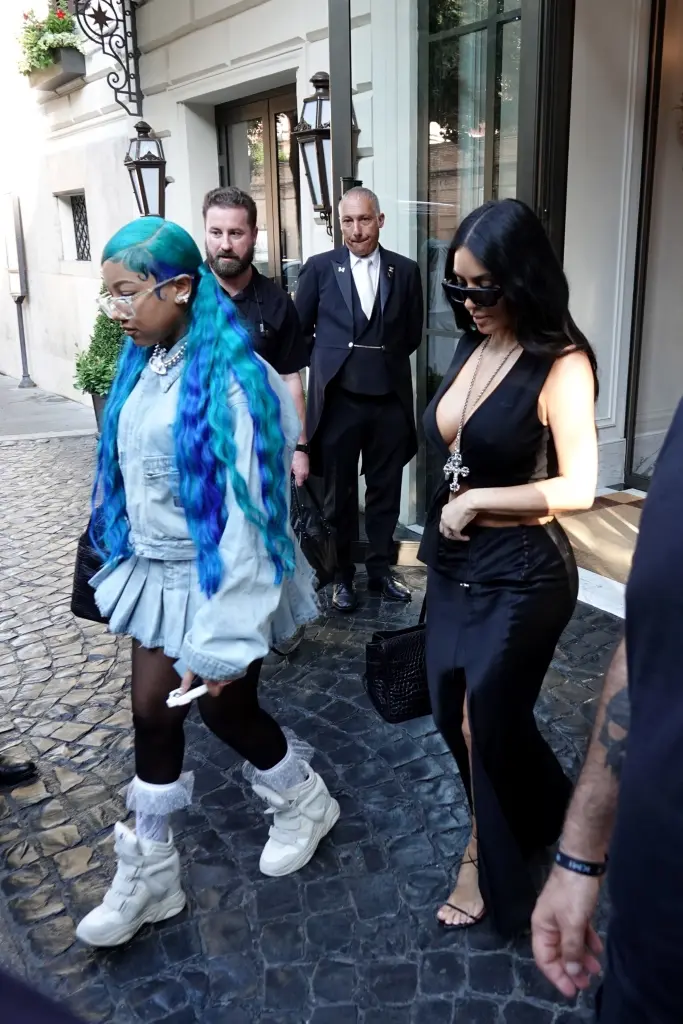 West matched her bright hair to her outfits during their trip