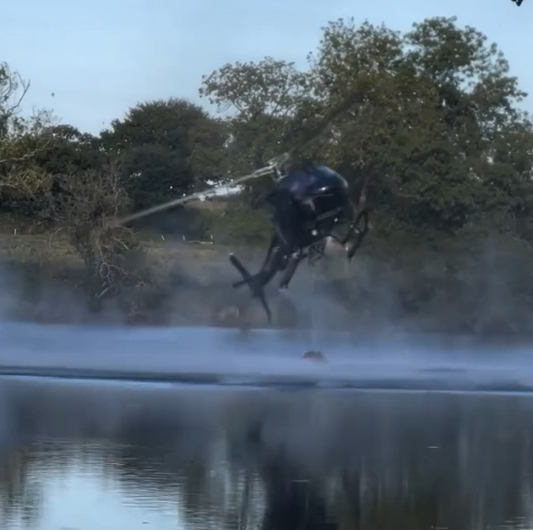 helicopter spins out of control above a lake in France