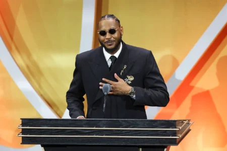Carmelo Anthony addresses the crowd during the 2025 Basketball Hall of Fame Enshrinement Ceremony