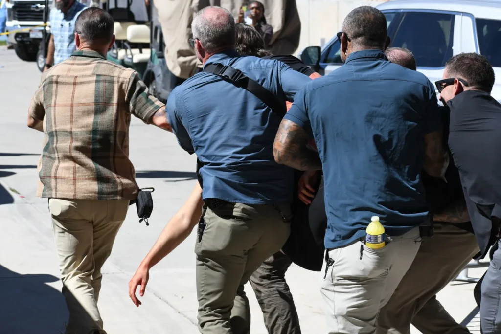 Kirk was seen being carried away from the scene of the shooting by security