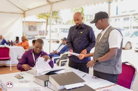 NUP SG Rubongoya presenting Bobi Wine's papers at the EC headquarters last week