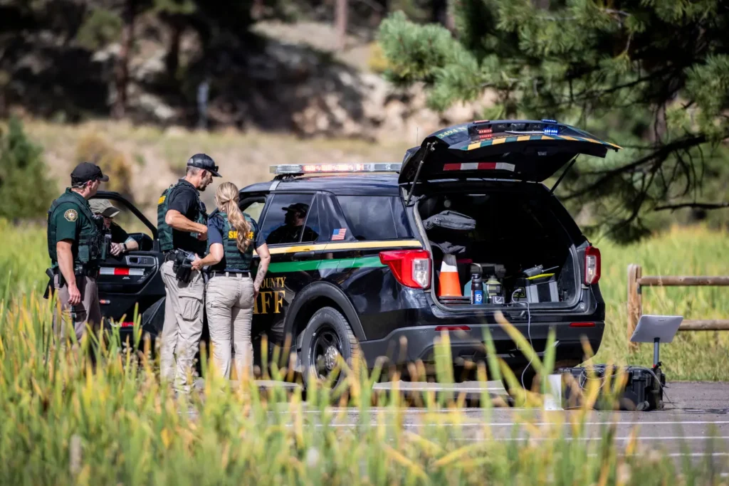 Colorado Teen Opens Fire at School — 2 Students Shot 3 Police officers standing at a checkpoint near Evergreen High School on September 10, 2025 in Evergreen