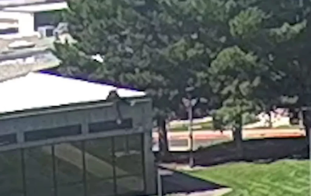 Charlie Kirk Shooter Caught on Video Fleeing Utah Campus 1 The suspected shooter jumping from the roof of the building