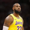 LeBron James #23 of the Los Angeles Lakers looks towards the crowd during a timeout against the Denver Nuggets in the second half of the NBA Opening night game at Ball Arena