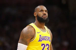 LeBron James #23 of the Los Angeles Lakers looks towards the crowd during a timeout against the Denver Nuggets in the second half of the NBA Opening night game at Ball Arena