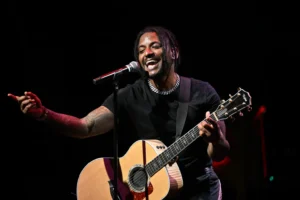 Lloyd Goes Viral at WNBA Game After Fans Roast His ‘Mailman Fit’ Llloyd performs onstage during “An Evening Of R&B” concert at Mable House Barnes Amphitheatre
