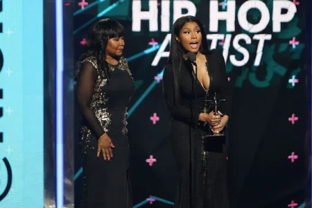 Nicki Minaj & Cardi B Clash Online, Kids Dragged Into Feud Nicki Minaj (R) and her mother Carol Maraj speak on stage at the 2015 BET Awards