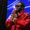 Sean “Diddy” Combs gestures in the press room during the MTV Video Music Awards at the Prudential Center