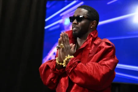 Sean “Diddy” Combs gestures in the press room during the MTV Video Music Awards at the Prudential Center