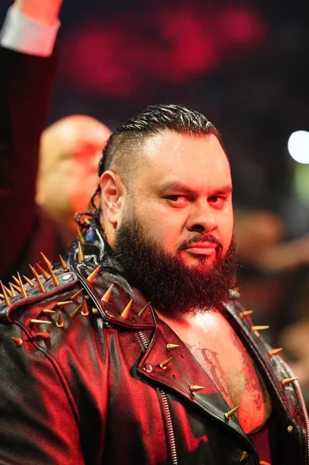 Bronson Reed Channels Notorious B.I.G. in Epic WWE Throwback Bronson Reed makes his entrance during SmackDown at Ball Arena