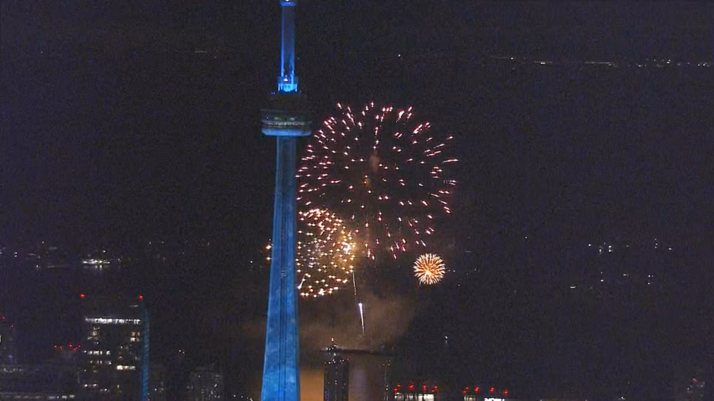 Fireworks explode as the CN Tower
