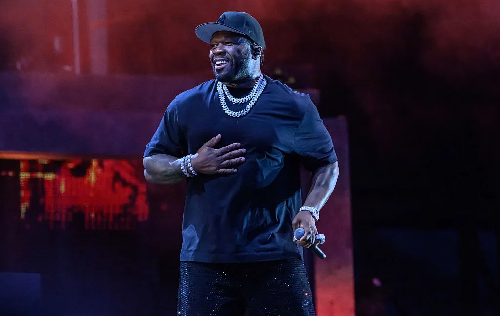 50 Cent performs onstage during a concert at Tottenham Hotspur Stadium