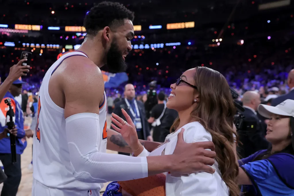 Jordyn Woods and her fiancé, Karl Anthony Towns of the New York Knicks, celebrate after winning the 2026 NBA Finals.