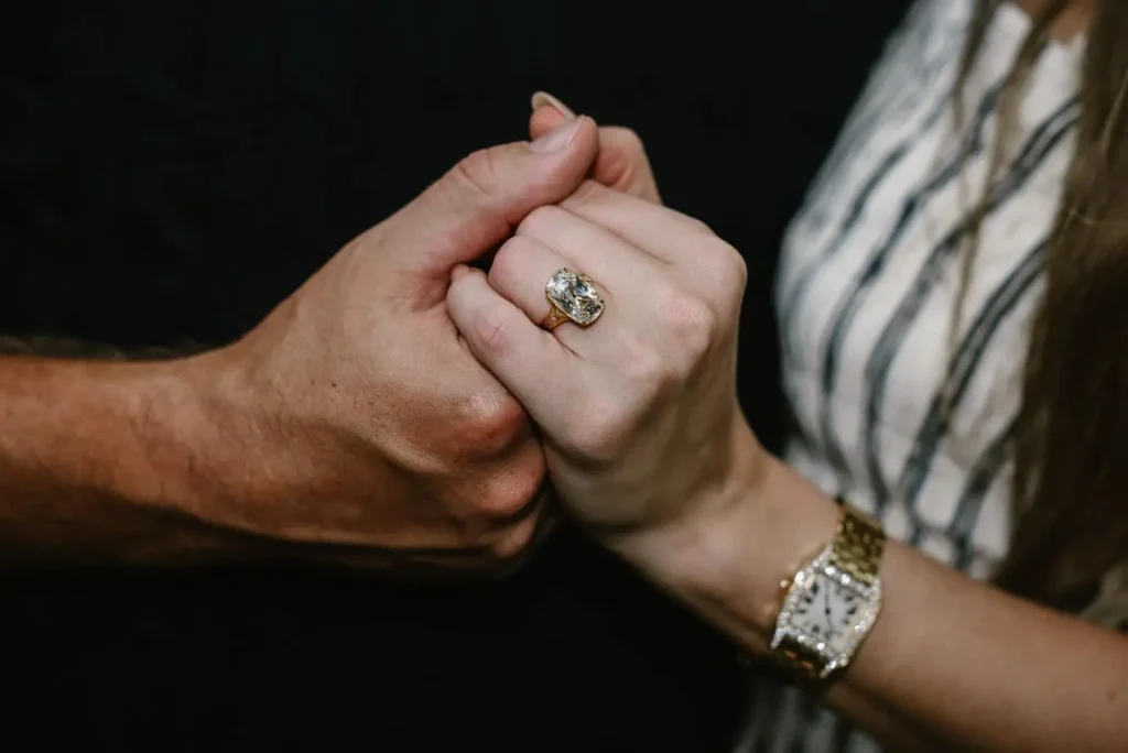 Travis proposed to Swift with a custom old mine brilliant cut diamond in a gold bezel setting