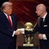 Gianni Infantino, President of FIFA, shakes hands with U.S. President Donald Trump as he receives the FIFA Peace Prize during the FIFA World Cup 2026 Official Draw