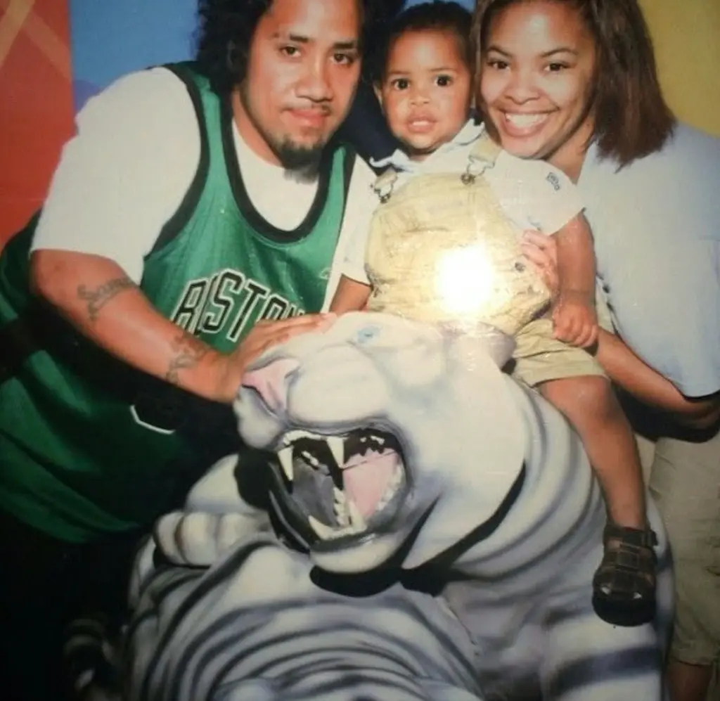 Jey Uso (Joshua Fatu) and Takecia with their son Jaciyah.
