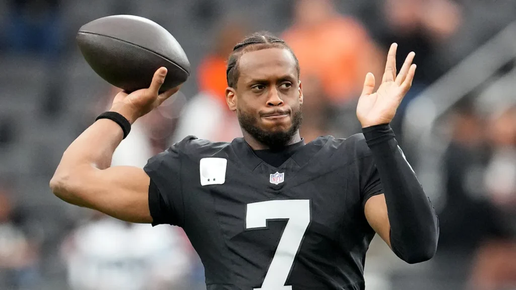 Las Vegas Raiders quarterback Geno Smith warms up before a game against the Cleveland Browns at Allegiant Stadium in Paradise, Nev., Nov. 23, 2025.