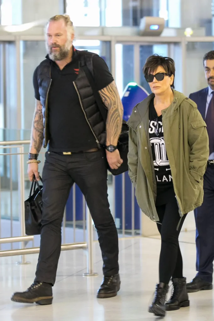 Mason Haynes with Kris Jenner at Charles de Gaulle airport on Oct. 7, 2015 in Paris, France.