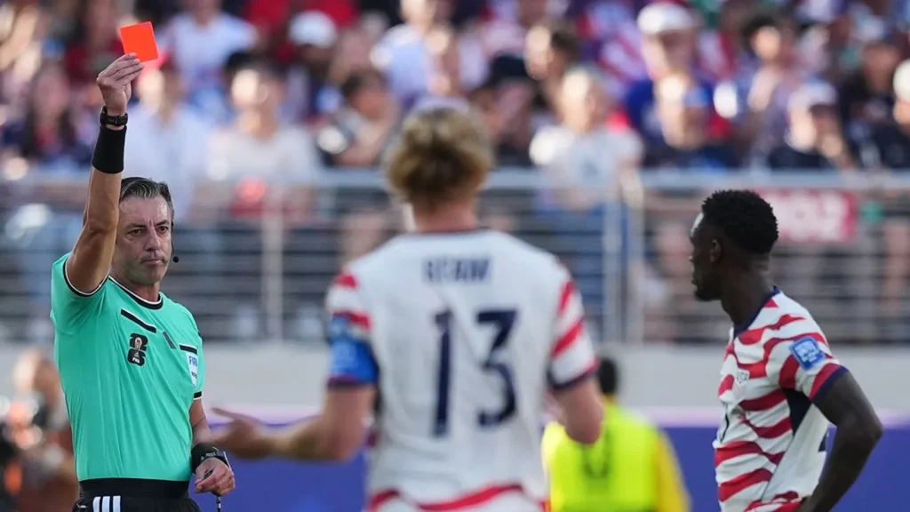 Donald Trump Reacts After FIFA Reverses Folarin Balogun Ban 7 Referee Raphael Claus shows a red card to Folarin Balogun, right, during the World Cup Round of 32 match against Bosnia in Santa Clara, Calif.