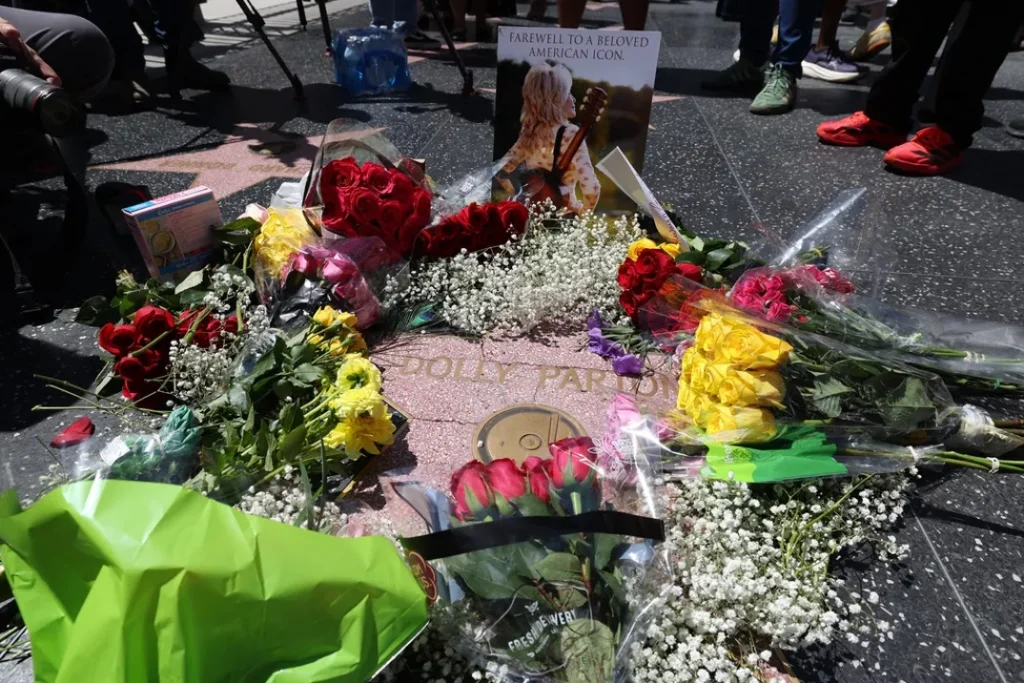 Dolly Parton Fans Cover Her Hollywood Walk of Fame Star With Flowers