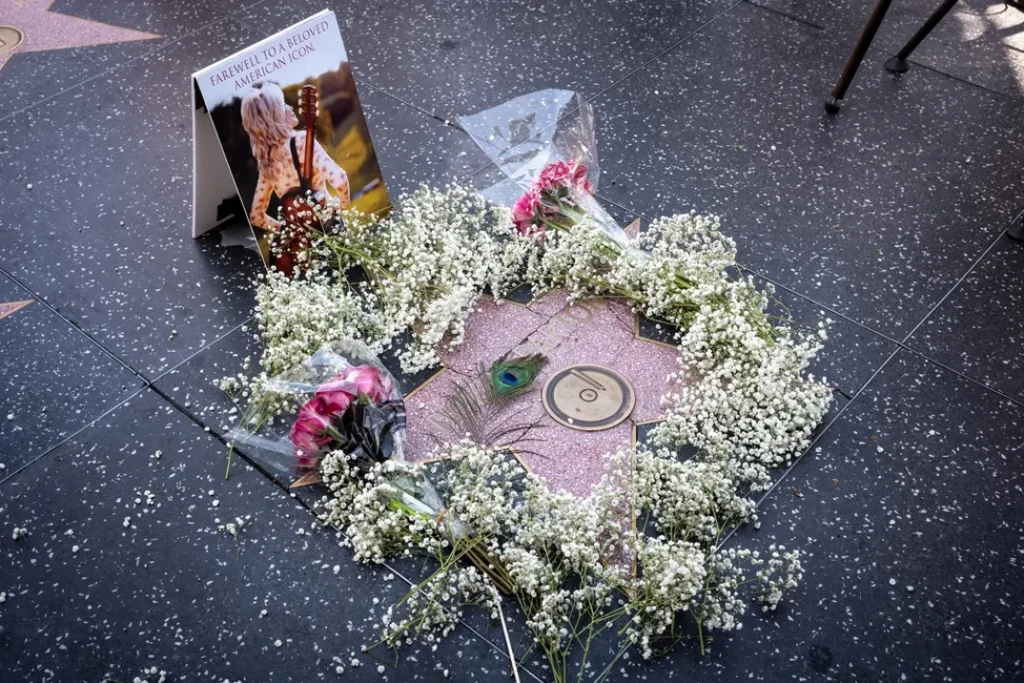 Dolly Parton Fans Cover Her Hollywood Walk of Fame Star With Flowers