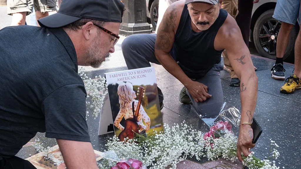 Dolly Parton Fans Cover Her Hollywood Walk of Fame Star With Flowers