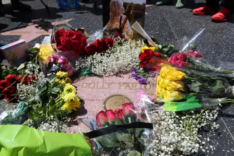 Dolly Parton Fans Cover Her Hollywood Walk of Fame Star With Flowers