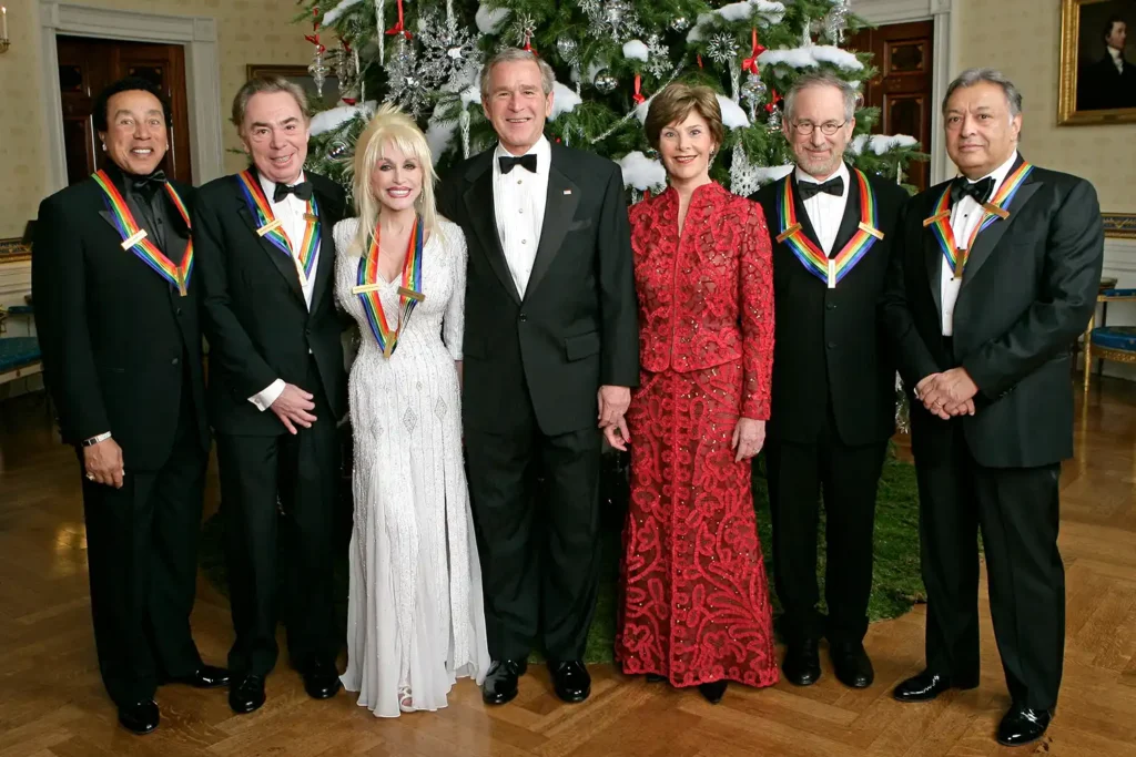 Dolly Parton stands with George and Laura Bush, and fellow Kennedy Center honorees, in 2006.