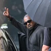 US rapper and producer Kanye West gestures upon arriving at Shanghai Pudong International Airport on July 11, 2025.
