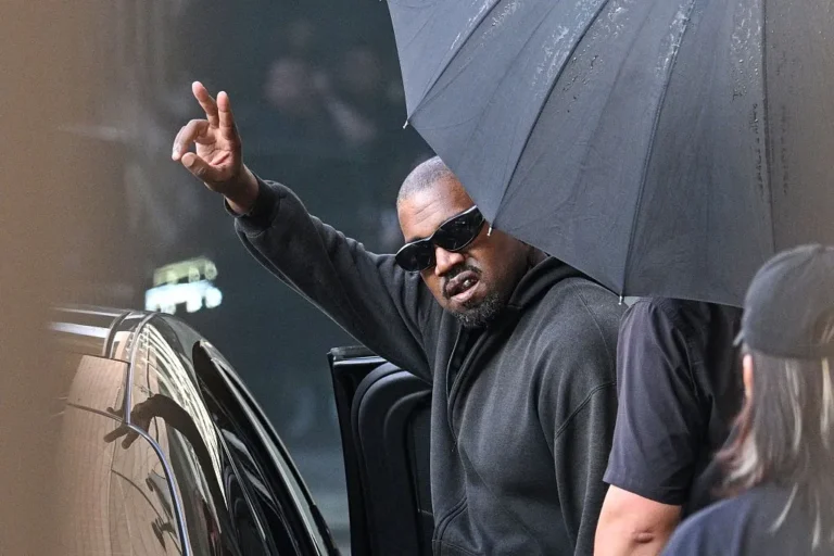 US rapper and producer Kanye West gestures upon arriving at Shanghai Pudong International Airport on July 11, 2025.