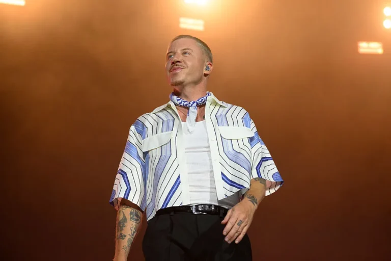 Petition Seeking Pink’s UNICEF Removal Surges Amid Dispute American rapper Macklemore performs live on stage during the 5th Lollapalooza Paris Festival on July 19, 2025 in Paris, France.