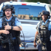 Officers investigate the aftermath of a shooting in Minneapolis Wednesday.